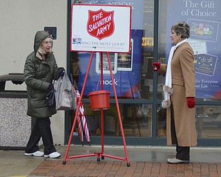 Katie Rickman | The Vindicator.Ellen Tressel, on right, greets Chris Milley of Boardman and wishes her a happy holiday as she donated money to the salvation army on Tuesday, Dec. 2, 2014.
