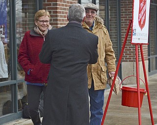 Katie Rickman | The Vindicator.Druann and Ralf Buzzacco of Youngstown shake hands with Jim Tressel out side of Barnes and Noble in Boardman where Tressel and his wife Ellen volunteered to spend several hours ringing the bells and collecting money for the Salvation Army on Tuesday, Dec. 2, 2014.