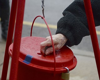 Katie Rickman | The Vindicator.A woman donated money to The Salvation Army after greeting Jim and Ellen Tressel who volunteered several hours to stand outside of Barnes and Noble in Boardman ringing the bells on Tuesday, Dec. 2, 2014.