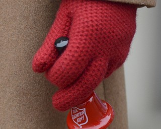 Katie Rickman | The Vindicator.Ellen Tressel dons gloves to embrace the chilly weather while volunteering with her husband Jim to raise money for The Salvation Army outside of Barnes and Noble on Tuesday, Dec. 2, 2014.