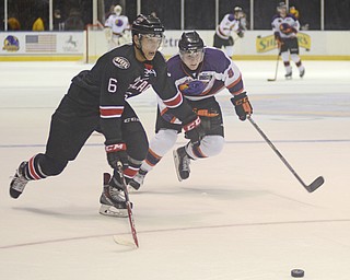 Katie Rickman | The Vindicator.Phantom's Josh Melnick (8) and Chicago Steel's Peter Tische (6) race to the puck during the second period on Wednesday, Dec. 3, 2014..