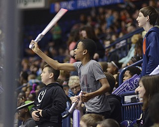 Katie Rickman | The Vindicator.Germaine Flakes 14 (Center) of Niles dances for the dance cam at the Phantom's game on on Wednesday, Dec. 3, 2014.