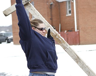 Tasha Bees of Mercer,Pa helps position a set during the drive through nativity set at the Kings Chapel United Methodist Church in New Castle, Pa on Friday morning.  Dustin Livesay  |  The Vindicator    11/28/14  New Castle Pa