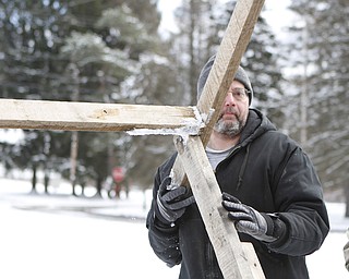 Brad Schell of New Castle, Pa lifts a set during the drive through nativity set at the Kings Chapel United Methodist Church in New Castle, Pa on Friday morning.  Dustin Livesay  |  The Vindicator    11/28/14  New Castle Pa