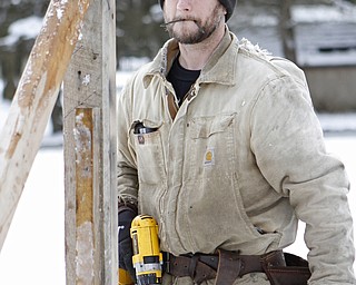 Jamey Bees of Mercer, Pa. builds a manger during the drive through nativity set at the Kings Chapel United Methodist Church in New Castle, Pa on Friday morning.  Dustin Livesay  |  The Vindicator    11/28/14  New Castle Pa