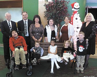 SPECIAL TO THE VINDICATOR
The 45th Annual GFWC Ohio Warren Junior Women’s League Champagne Luncheon and Style Show took place recently at Packard Music Hall in Warren. The show’s theme was “We’re Dreaming of a White Christmas,” and it featured star models from the Children’s Rehabilitation Center in Howland. The proceeds go to the CRC’s scholarship fund, so no child is turned away because of inability to pay. In the front row, from left, are Nicholas Galela, Landon Brown, Amara DeVault, Krista Monsman and Cayden Davies. Standing are CRC President Bob Fowler, CRC Executive Director Bob Foster, WJWL President Renee Maiorca, Zara Polizzi, luncheon Chairwoman Melanie Cann and style show coordinator Esther Gartland.