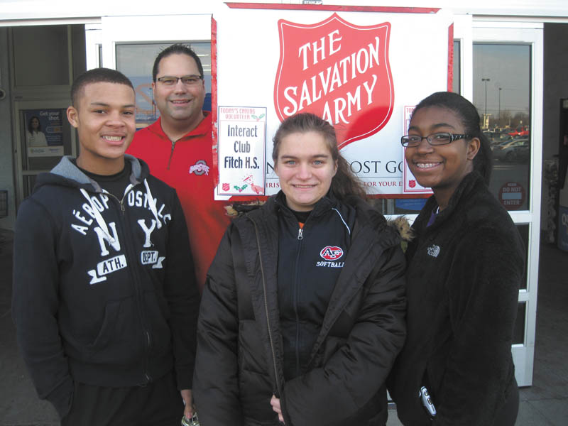 SPECIAL TO THE VINDICATOR: Members of the Fitch Interact Club and Austintown Rotary kicked off the Christmas season with the annual project of both groups, ringing the bell for the Salvation Army at Wal-Mart in Austintown. Volunteers, from left, are Jared Perdue, Dr. Mike Cafaro, McKayla Gaus and Seaven Weaver.
