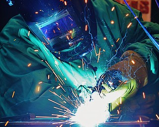 Jeff Lange | The Vindicator  Esther Thomas of Struthers welds steel during Monday afternoon's welding class at MCCTC in Canfield. Esther is one of 4 women in the engineering program.