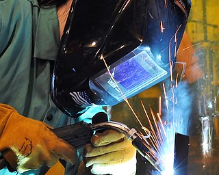 Jeff Lange | The Vindicator  Morgan Cook of Canfield mig welds two pieces of steel together during class Monday afternoon at MCCTC in Canfield.