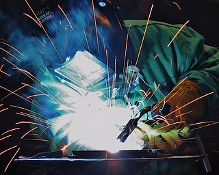 Jeff Lange | The Vindicator  Esther Thomas of Struthers practices her mig welding on scrap steel during the welding class held at MCCTC in Canfield.