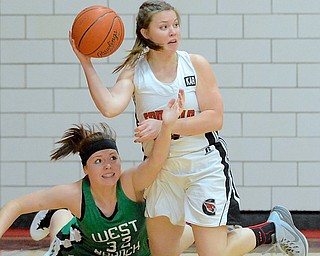 Jeff Lange | The Vindicator  West Branch's Paige Walsh (32) attempts to get her fingers on the ball as Canfield's Lynnae Whitehead searches for an open teammate during first period action in Canfield, Wednesday night.
