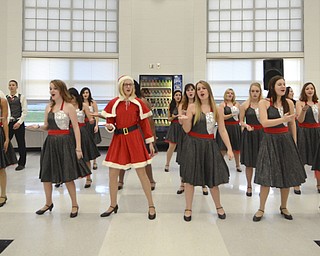 Katie Rickman | The Vindicator.Members of the Struthers High School Show Choir dance and sing Christmas themed songs at the senior citizens dinner at Struthers High School on Thursday, Dec. 4, 2014.