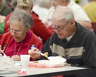 Katie Rickman | The Vindicator.Alice and Kenneth Kopp of Struthers enjoy a dinner at the senior citizens dinner at Struthers High School on Thursday, Dec. 4, 2014.