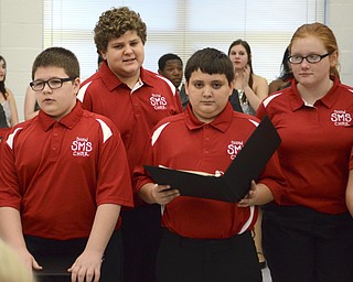 Katie Rickman | The Vindicator.Students at Struthers Middle School's Show Choir (L-R) Kolton Blough 13, Andrew Lucas 13, Joseph Lucente 13, and MAggie Lucarelli 13 sing songs at the senior citizens dinner at Struthers High School on Thursday, Dec. 4, 2014.