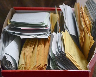 Katie Rickman | The Vindicator.Five years after Sam Messina helped in the process of closing down Westinghouse Electric Corporation in Sharon, PA he was still working in an office to sort out issues between former employees and the company. Shown here are slips of paper his secretary kept for him showing the mass volume of missed phone calls over that time.