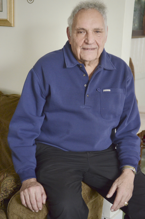Katie Rickman | The Vindicator.Sam Messina, former human-resource director at Westinghouse Electric Corporation was one of the last to leave the plant when it was shut down in 1985. He still receives phone calls regarding pension checks and such from former employees. Here, he poses for a photo in his Sharon, PA home on Thursday, Dec. 4, 2014.