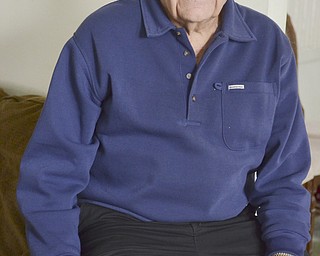 Katie Rickman | The Vindicator.Sam Messina, former human-resource director at Westinghouse Electric Corporation was one of the last to leave the plant when it was shut down in 1985. He still receives phone calls regarding pension checks and such from former employees. Here, he poses for a photo in his Sharon, PA home on Thursday, Dec. 4, 2014.