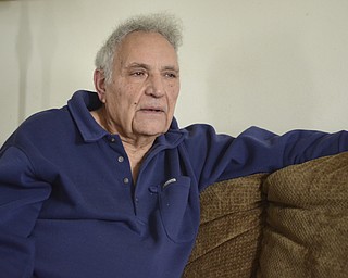 Katie Rickman | The Vindicator.Sam Messina, former human-resource director at Westinghouse Electric Corporation was one of the last to leave the plant when it was shut down in 1985. He still receives phone calls regarding pension checks and such from former employees. Here, he poses for a photo in his Sharon, PA home on Thursday, Dec. 4, 2014.