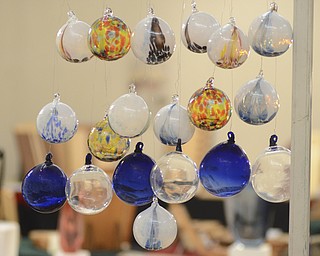 Katie Rickman | The Vindicator.Blown glass christmas ornaments hang from fishing wire at   the the 44th Annual American Holiday Arts & Crafts Show and Sale at The Butler Institute of American Art on Saturday, Dec. 6, 2014.