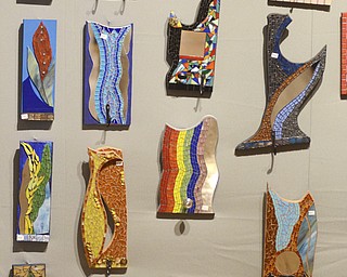Katie Rickman | The Vindicator.Mosiac artwork hangs on a wall during the 44th Annual American Holiday Arts & Crafts Show and Sale at The Butler Institute of American Art on Saturday, Dec. 6, 2014.