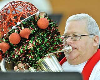 Jeff Lange | The Vindicator  Bob Barnett of Salem plays Christmas music with the band of tubas and baritones, Saturday afternoon at the Eastwood Expo Center as part of the annual Tubachristmas.