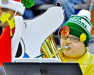 Jeff Lange | The Vindicator  Caleb Miklas (14) of Mercer, PA plays a Christmas tune with a little help from Snoopy and Woodstock during Saturday's Tubachristmas concert in Niles. Caleb came to the event with his father George Miklas. Together they won best decorated baritones.