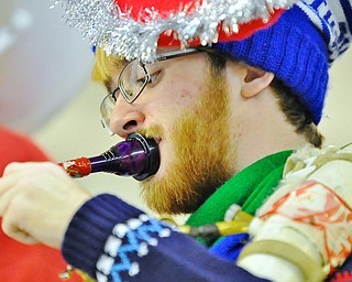 Jeff Lange | The Vindicator Howland senior Jonathan Bennett plays his sousaphone during Saturday's Tubachristmas concert in Niles.