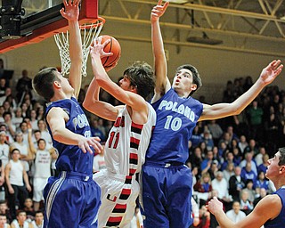 Poland defenders Tate Duarte (10) and Jared Burkert make it difficult for Canfield’s Andrew Midgley (11) to score in a game last year. The Bulldogs hope they have the right pieces to make a return trip to the regional final this season.