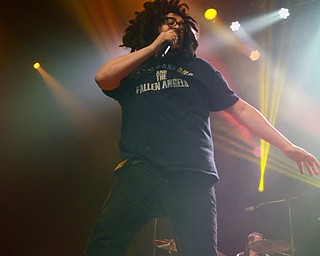 Katie Rickman | The Vindicator.Adam Duritz of Counting Crows steps up onto a monitor and sings during a packed out show at Packard Music Hall in Warren on Saturday, Dec. 6, 2014.