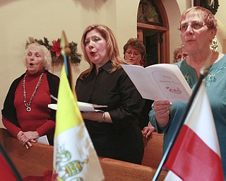 William d Lewis The vindicator From left, Alexandria Copich, Sandra Cika and Ursula Gerchak, all members the choir at the former St Casimir Church on Jefferson in youngstown sing during  a traditional Polish vigil dinner and singing Sunday 12-7-14.