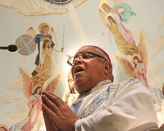 William D. Lewis the vindicator Bishop George Murry during mass of dedication at Our Lady of Mt Carmel Church in Youngstown 12-8-14 as church was named a minor basilica. see release.