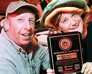 The 2014 Burger of the Year Award was presented to Marilyn and Al McClung, owners of The New Manhattan in
Hubbard, on Dec. 5 by the members of the Mahoning Valley Burger Review Board.