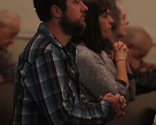 Bryan Kobylanski of Austintown kneels down to pray at St. Stanislaus Church in Youngstowns during the 73rd annual Pearl Harbor Mass on Sunday morning.  Dustin Livesay  |  The Vindicator  12/7/14  Youngstown.