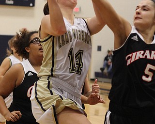 Girard's Makayla Trebella (5) blocks a shot that is taken by Brookfield's Destiny May (14) during the first half of Wednesday nights matchup at Bookfield High School. Dustin Livesay  |  The Vindicator  12/10/14  Brookfield, Ohio.