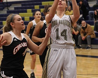 Brookfield's Destiny May (14) puts up a shot while being defended by Girard's Megan Payich (4) during the first half of Wednesday nights matchup at Bookfield High School. Dustin Livesay  |  The Vindicator  12/10/14  Brookfield, Ohio.