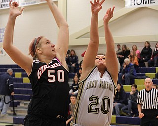 Brookfield's Michaela Gaurding (20) puts up a shot that is defended by Girard's Camille Stoffick (50) during the first half of Wednesday nights matchup at Bookfield High School. Dustin Livesay  |  The Vindicator  12/10/14  Brookfield, Ohio.
