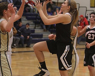Girard's Megan Payich (4) goes up for a shot while being defended by Brookfield's Destiny May (14) during the first half of Wednesday nights matchup at Bookfield High School. Dustin Livesay  |  The Vindicator  12/10/14  Brookfield, Ohio.