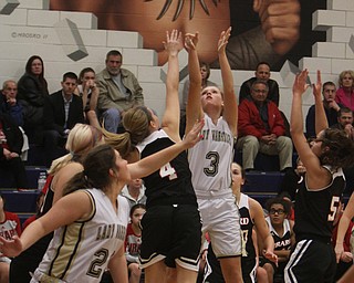 Brookfield's Autumn Kirila puts up a jump shot while being defended by Girard's Megan Payich during the first half of Wednesday nights matchup at Bookfield High School. Dustin Livesay  |  The Vindicator  12/10/14  Brookfield, Ohio.