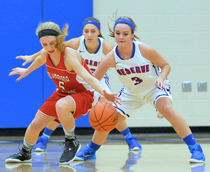 Jeff Lange | The Vindicator  Reserve's Lauren Falasca (3) looks to steal the ball away from Clippers' Baylie Mook (5) as she loses control of the ball in the first period of Thursday night's matchup at Western Reserve.