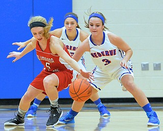 Jeff Lange | The Vindicator  Reserve's Lauren Falasca (3) looks to steal the ball away from Clippers' Baylie Mook (5) as she loses control of the ball in the first period of Thursday night's matchup at Western Reserve.