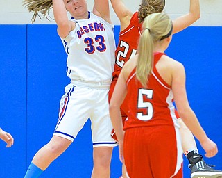 Jeff Lange | The Vindicator  Reserve's Aleah Hughes (33) grabs a rebound against Columbiana's Lauren Schlueter (21) during first period action at Western Reserve High School.