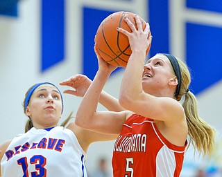 Jeff Lange | The Vindicator  Clippers' Baylie Mook (5) goes for a layup in front of Reserve's Rachel Maslach (13) in the third period of Thursday night's game at Western Reserve High School.