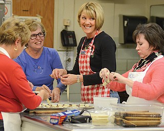 Members of Women of the Evangelical Lutheran Church of America at Bethel Lutheran Church in Boardman make clothespin cookies for the Christmas cookie walk, soup and quilt sale set from 9 to 11 a.m. Saturday. From left are Sherri Remias, Sandy Dorman, Delaine DeChellis and Shelia Kidd.