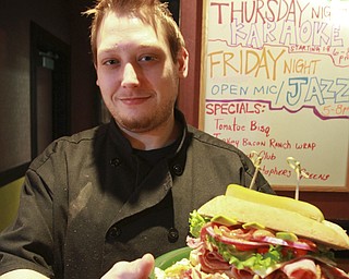 William D. Lewis the vindicator  Ryan Komara, chef at Christophers in the City Centre One building, shows off one of his creations at the popular downtown eatery.