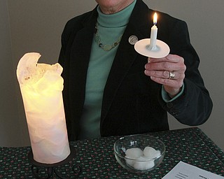 William D Lewis The Vindicator  Sister Pat Fesler with items used during her Break Throught The darkness service.
