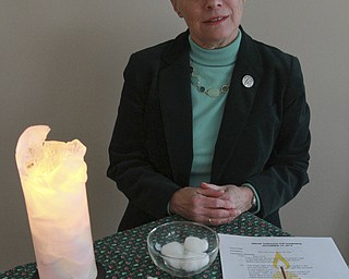 William D Lewis The Vindicator  Sister Pat Fesler with items used during her Break Throught The darkness service.