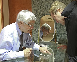William D Lewis The Vindicator Jerry Lee's Quality Jewlery mgr Richard Thomashow, shows items to customer Randy Rummell at the 20 Federal Place location 12-9-14.