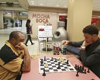 William D Lewis The Vindicator WILLIE JONES, LEFT, A VXI EMPLOYEE, AND RAY CULVER, WHO WORKS DOWNTOWN,PLAY A GAME OF CHESS IN THE FOOD COURT AT  20 Federal Place  12-9-14. THEY SAY A NUMBER OF CHESS PLAYER GATHER IN THE FOOD COURT.