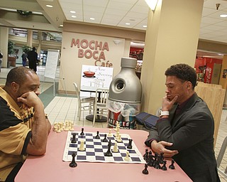 William D Lewis The Vindicator WILLIE JONES, LEFT, A VXI EMPLOYEE, AND RAY CULVER, WHO WORKS DOWNTOWN,PLAY A GAME OF CHESS IN THE FOOD COURT AT  20 Federal Place  12-9-14. THEY SAY A NUMBER OF CHESS PLAYER GATHER IN THE FOOD COURT.