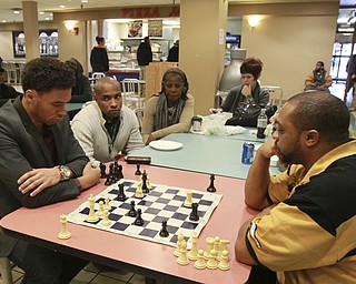 William D Lewis The Vindicator RAY CULVER, WHO WORKS DOWNTOWN AND WILLIE JONES, LEFT, A VXI EMPLOYEE, ,PLAY A GAME OF CHESS IN THE FOOD COURT AT  20 Federal Place  12-9-14. THEY SAY A NUMBER OF CHESS PLAYER GATHER IN THE FOOD COURT.